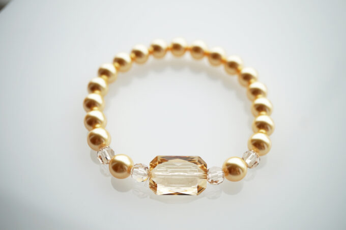 Swarovski pärlitest suure kuldse kristalliga käevõru kuldsetest swarovski pärlitest käevõru